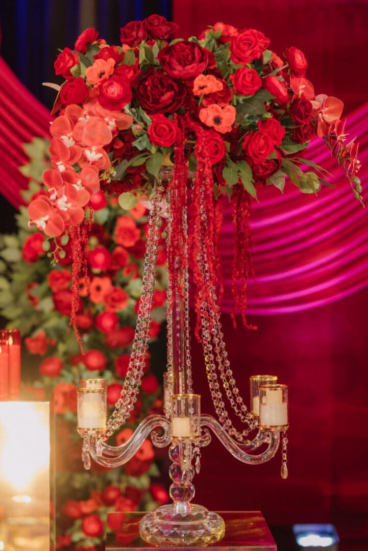 Tall crystal candelabra centerpiece with red floral arrangement in Washington DC